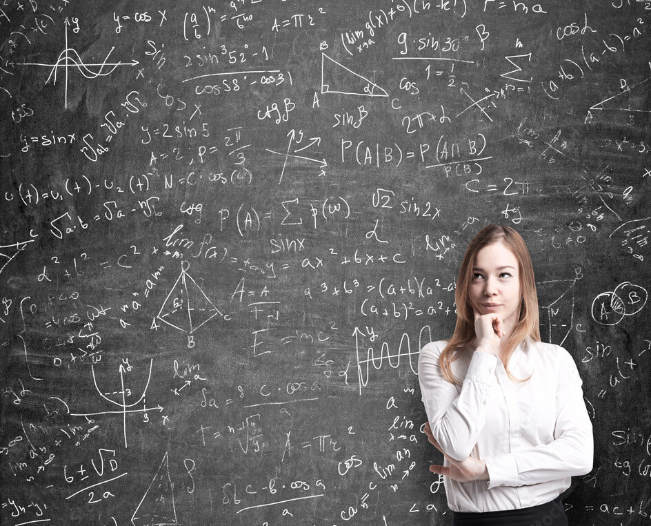  Math formulas and logic are drawn on the black chalkboard.