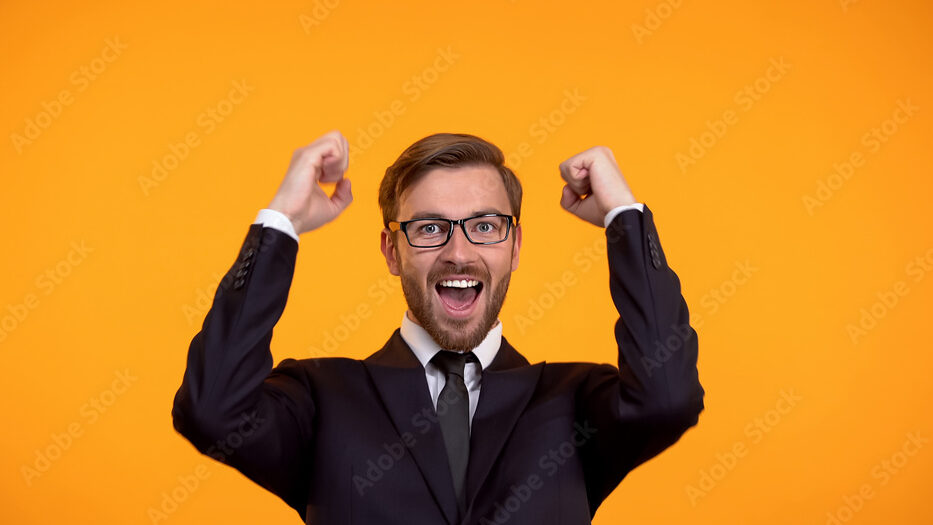 Cheerful businessman celebrating successful investment, promotion, employment