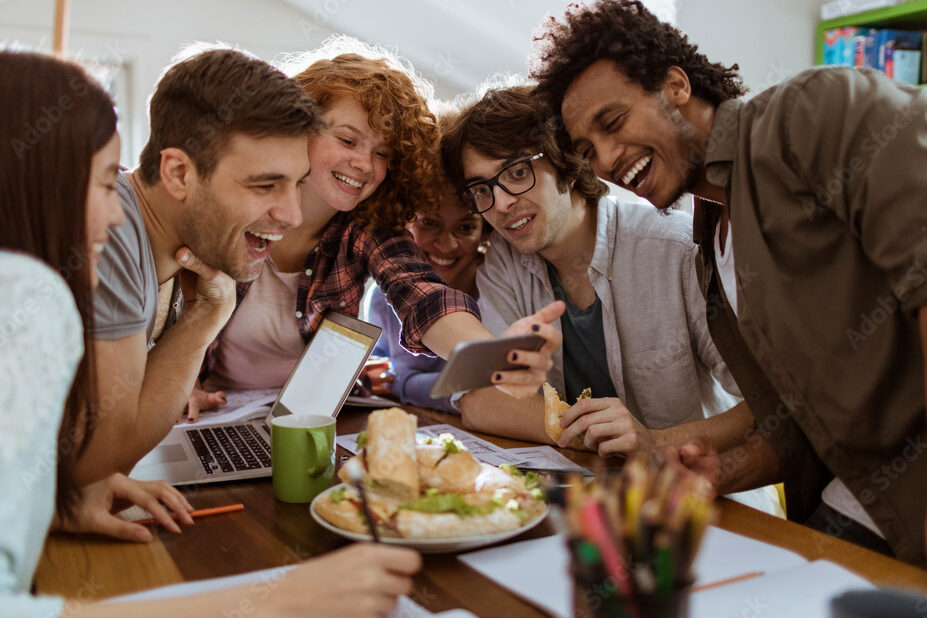 Group of friends taking a selfie while studying together at home