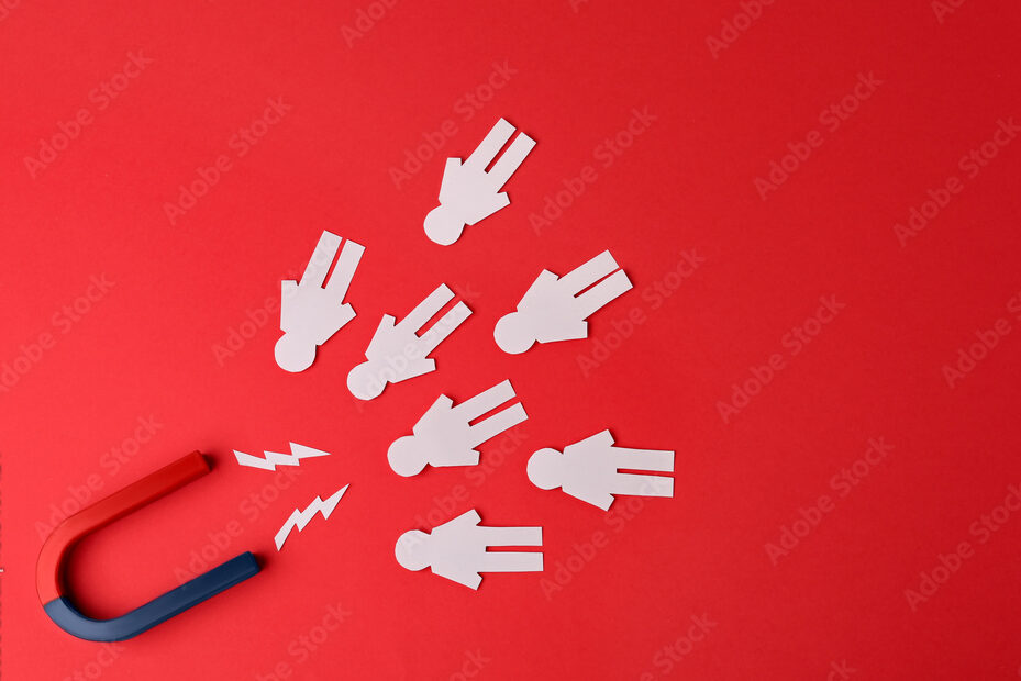 Magnet and paper people on red background, flat lay