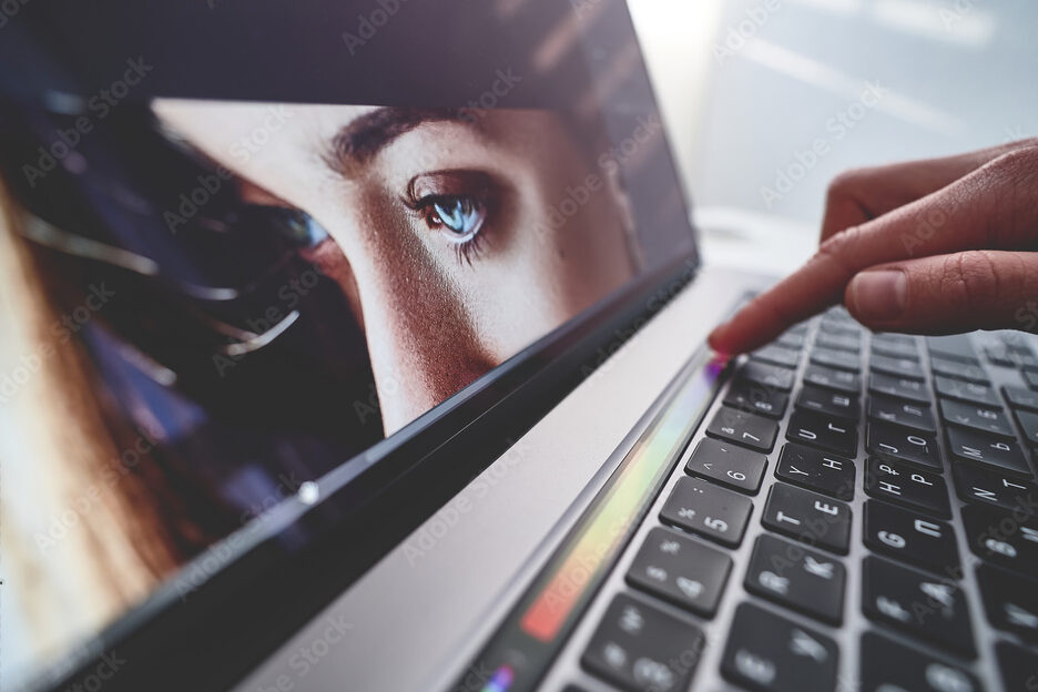 Retoucher photographer uses touchpad for adjustment color correction during retouching and  editing photo