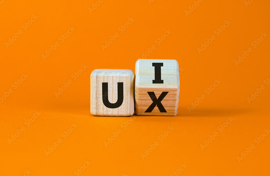 UX design or UI design. Turned cube and changed the words 'UX' to 'UI'. Beautiful orange background. Business concept. Copy space.